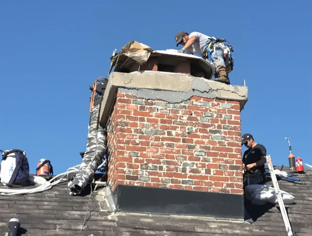Lake Elsinore Chimney Sweep installing a custom chimney crown in Lake Elsinore, CA