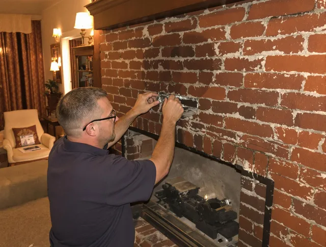 Lake Elsinore Chimney Sweep expert fixing a fireplace in Lake Elsinore, CA